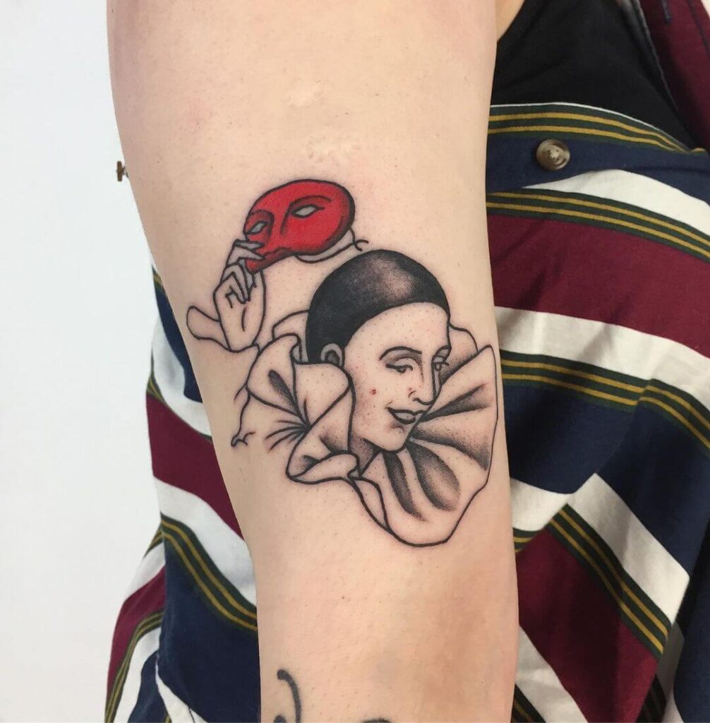 Tattoo of a jester on the arm