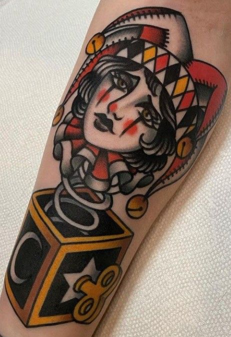 Tattoo of a jester on the leg