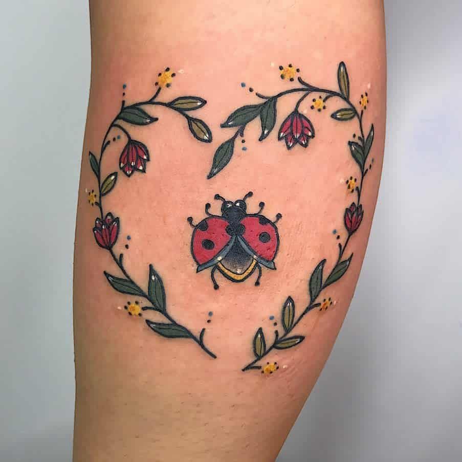 Ladybug tattoo on the shin for women