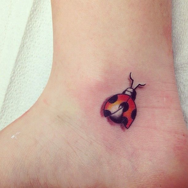 Ladybug tattoo on ankle for women