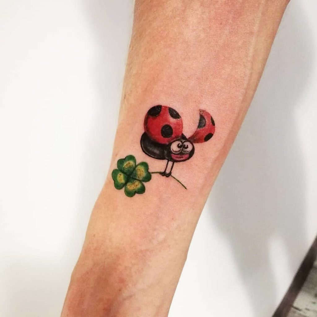 Ladybug tattoo on forearm for men