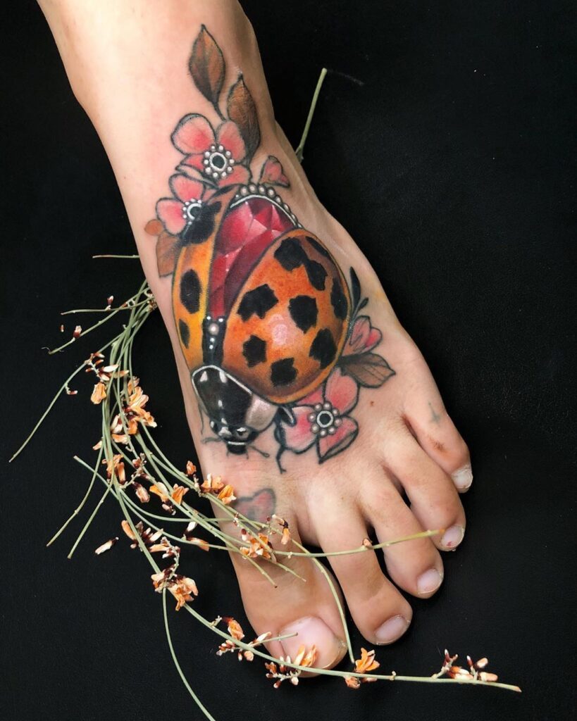 Ladybug tattoo on ankle for women