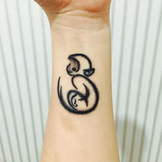 Monkey tattoo on the arm for women