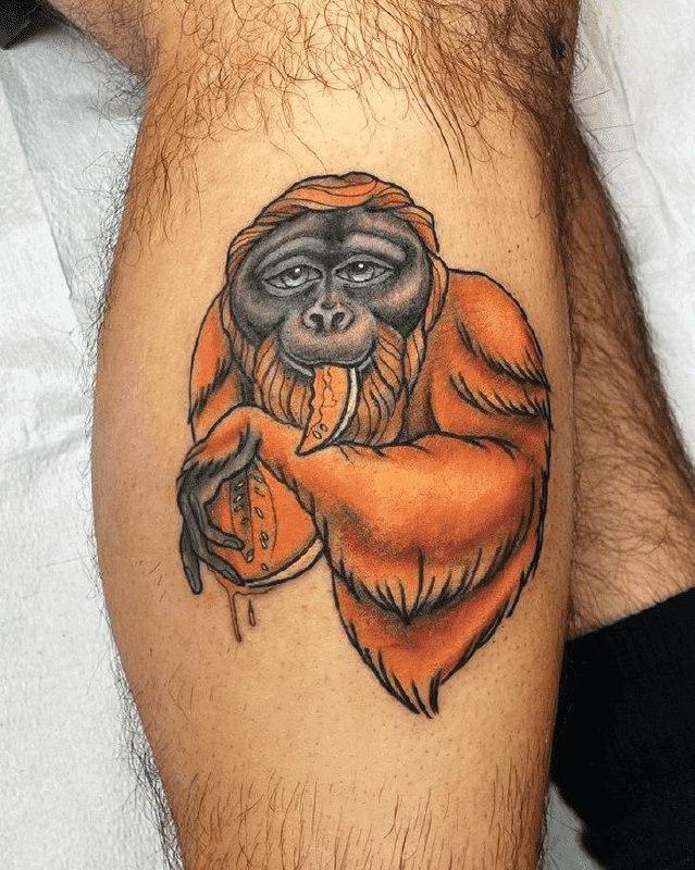 Monkey tattoo on the shin for men