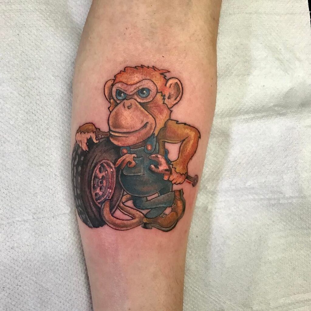 Monkey tattoo on the forearm for men