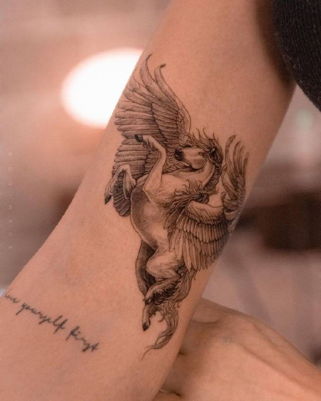 Pegasus tattoo on the shoulder for women