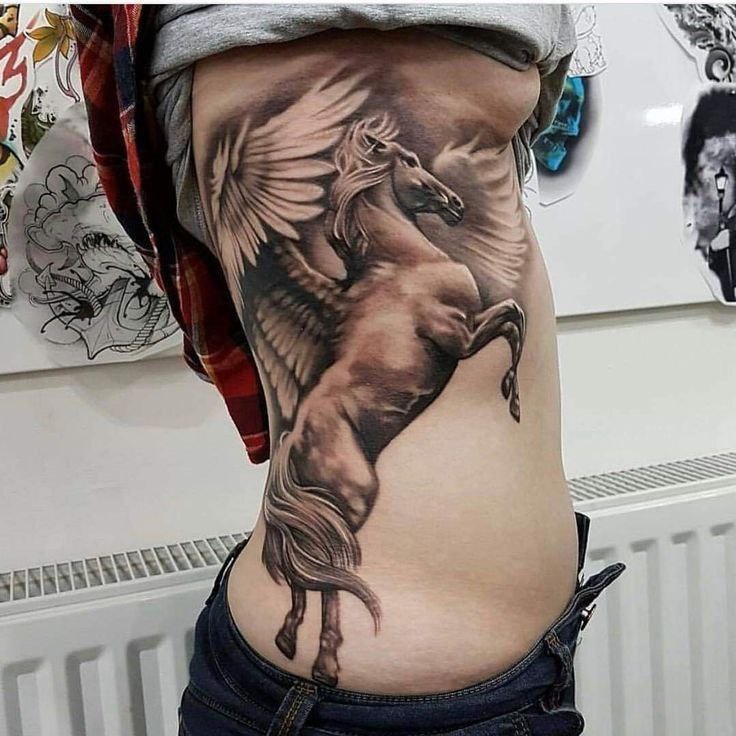 Pegasus tattoo on the side for women