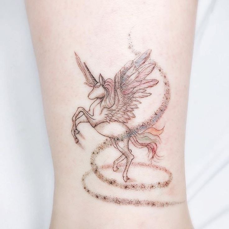 Pegasus tattoo on the shin for women