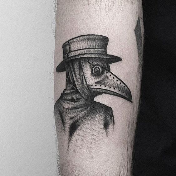 Plague doctor tattoo on the arm for men