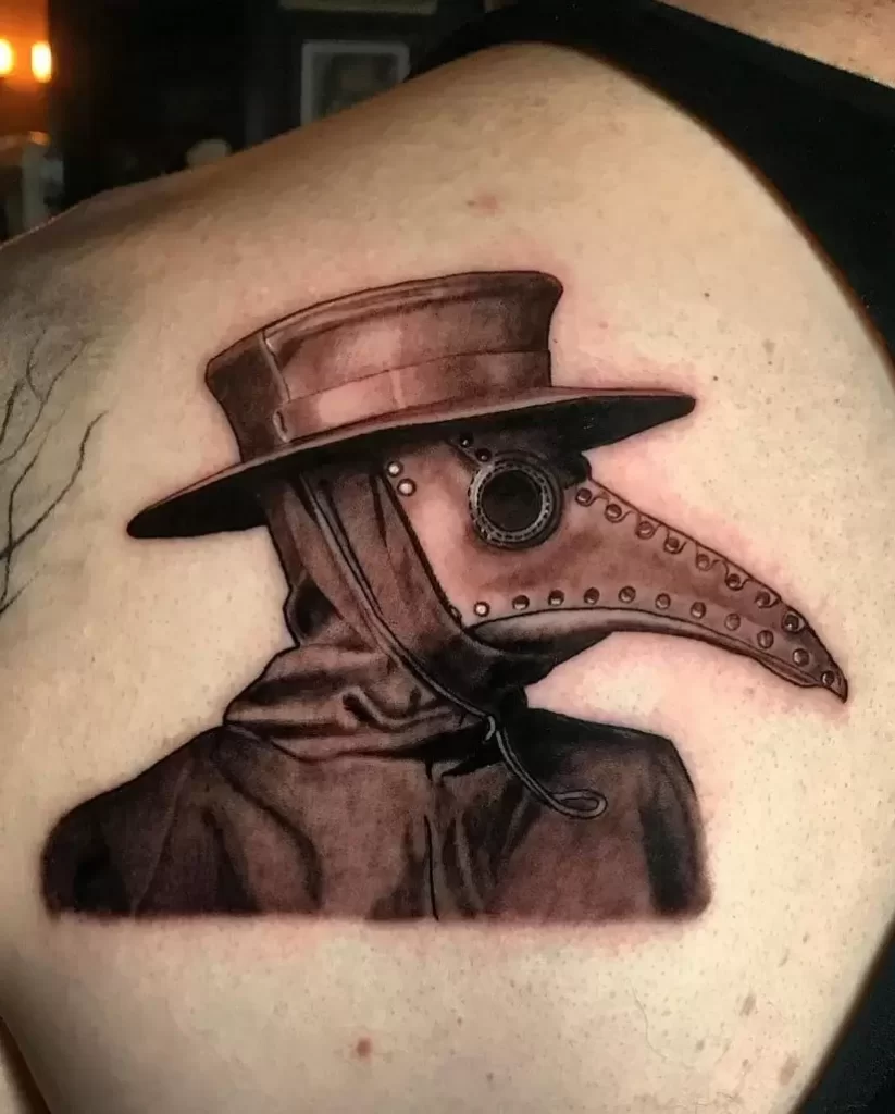 Plague doctor tattoo on the shoulder blade for men