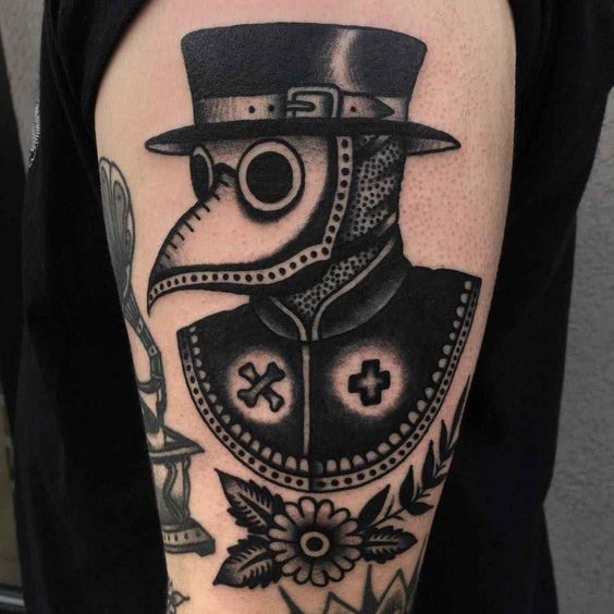 Plague doctor tattoo on the shoulder for men