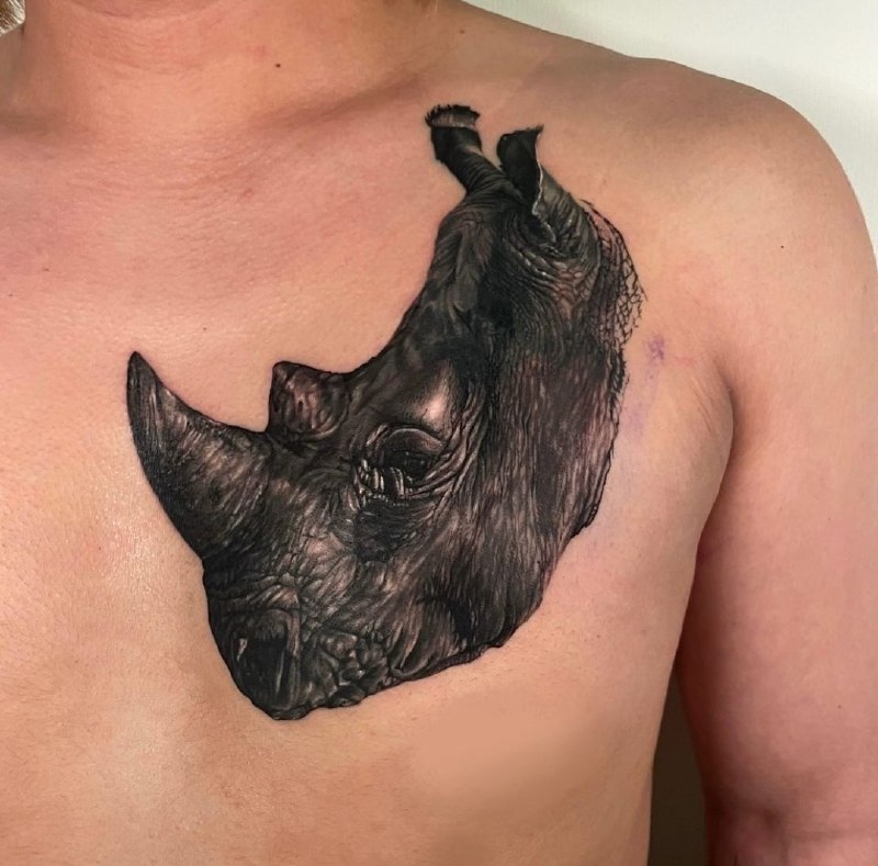 Rhinoceros tattoo on the chest for men