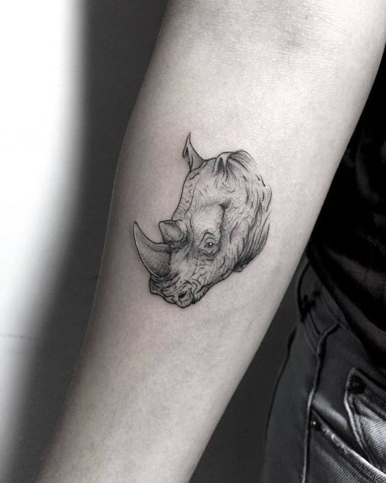 Rhinoceros tattoo on forearm for women