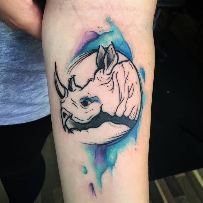 Rhinoceros tattoo on forearm for women