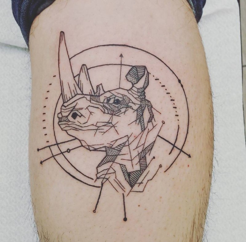 Rhinoceros tattoo on the calf for men