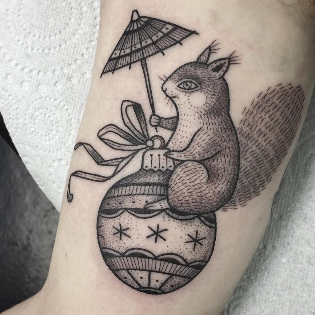 Squirrel tattoo on the biceps for men