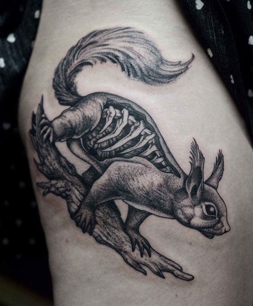 Squirrel tattoo on the thigh for women