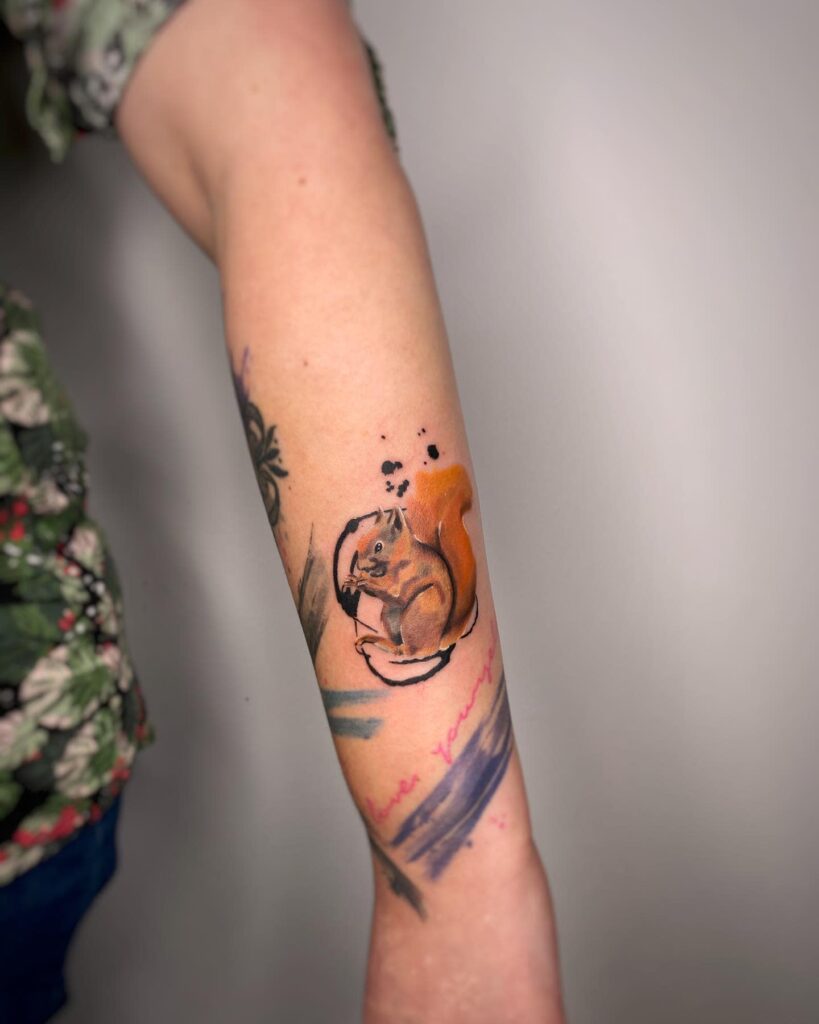 Tattoo of a squirrel on the arm for men