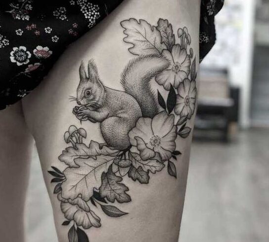 Squirrel tattoo on the thigh for women