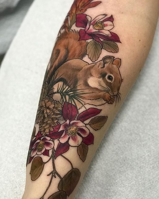 A squirrel tattoo on the forearm for women