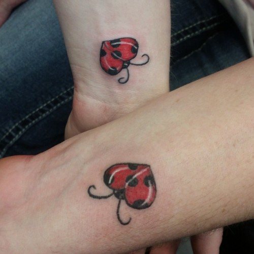 Ladybug tattoo on the arms