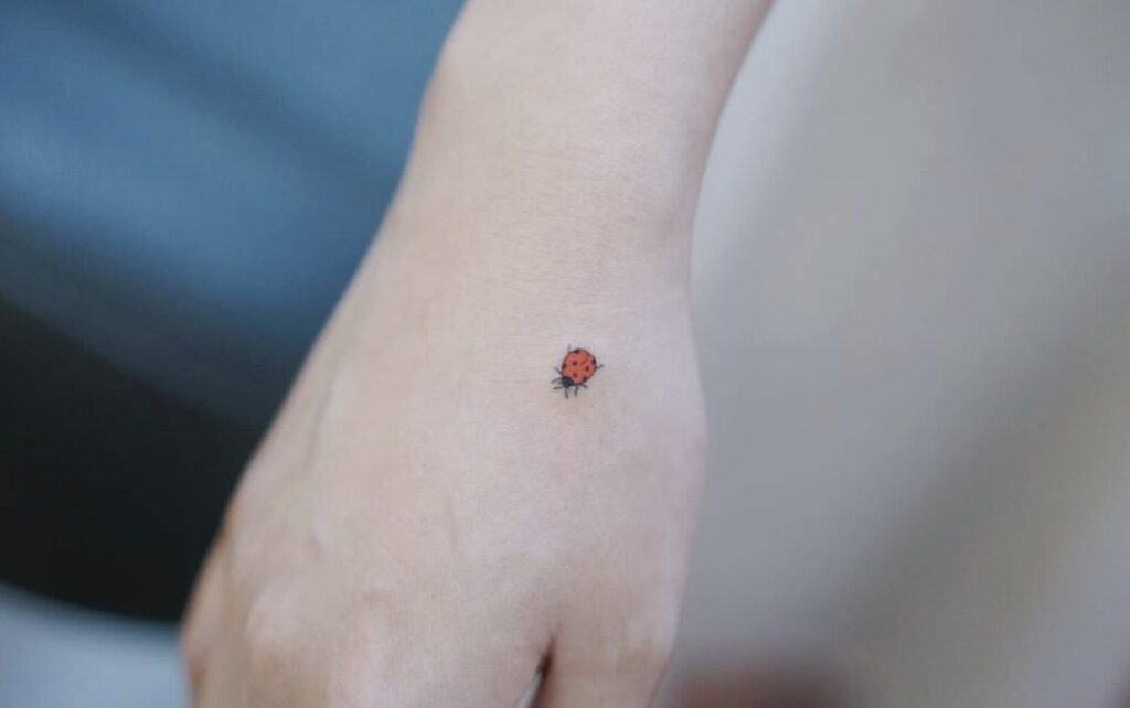 Ladybug tattoo on the wrist