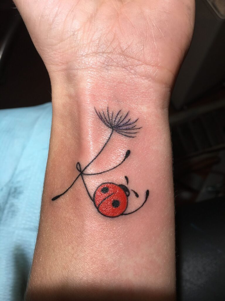 Ladybug tattoo on the arm for men