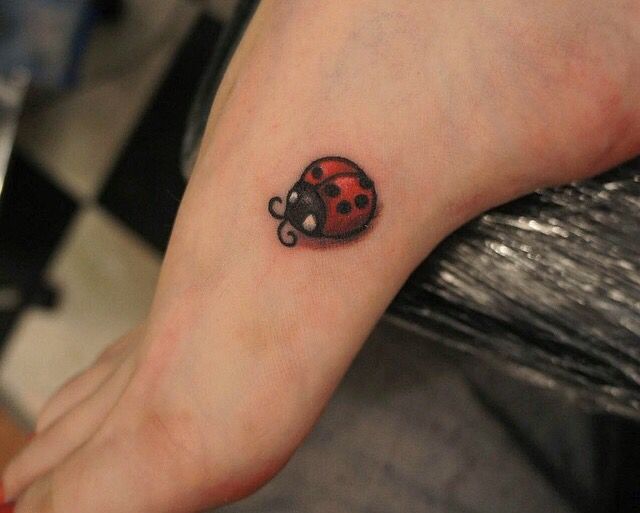 Ladybug tattoo on ankle for women