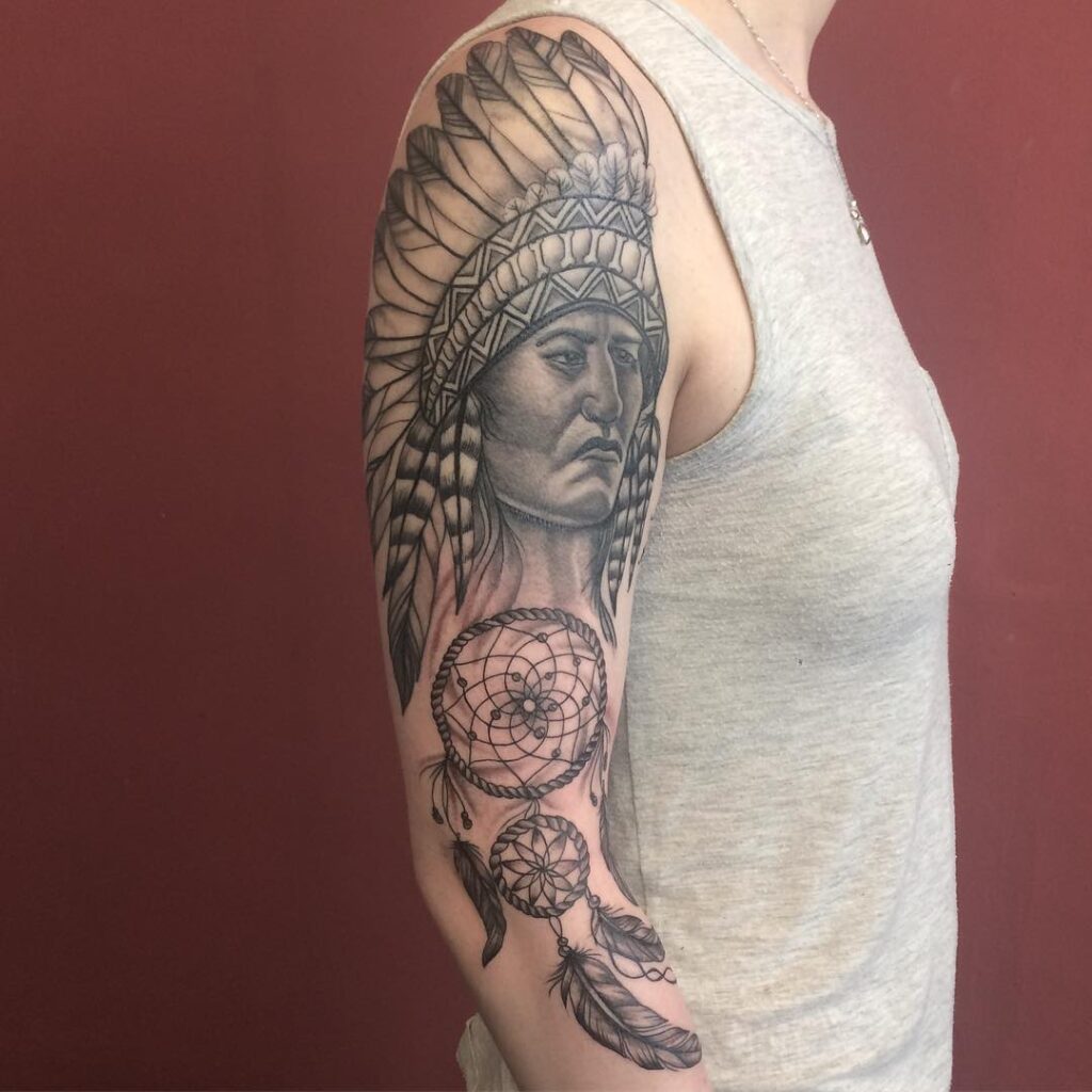 Indian tattoo on the arm for women