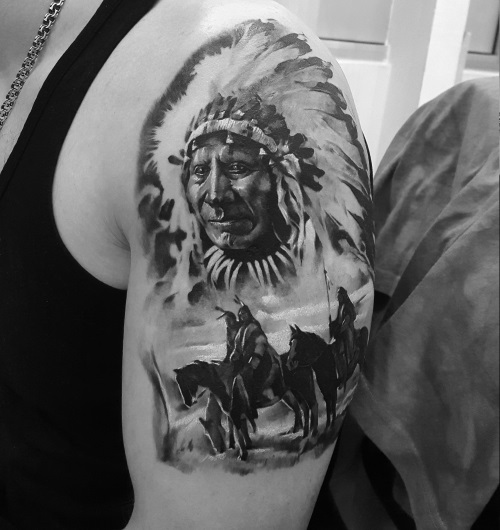 Indian tattoo on the shoulder for men