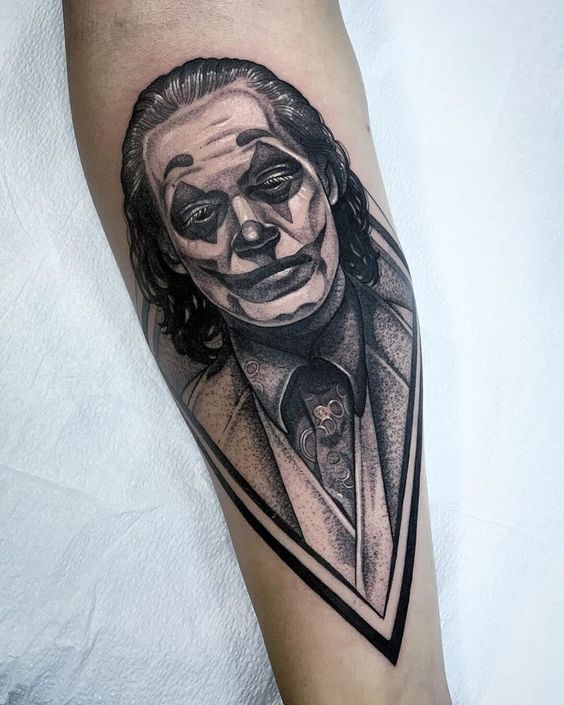 Joker tattoo on the forearm for women