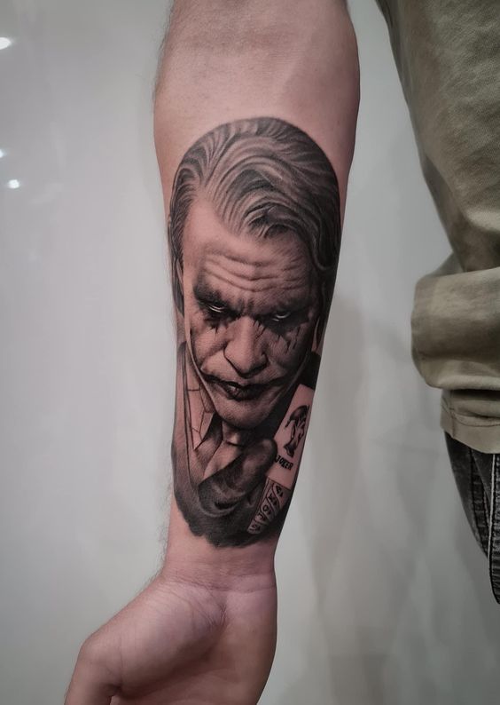 Joker tattoo on the forearm for men