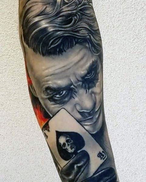 Joker tattoo on the arm