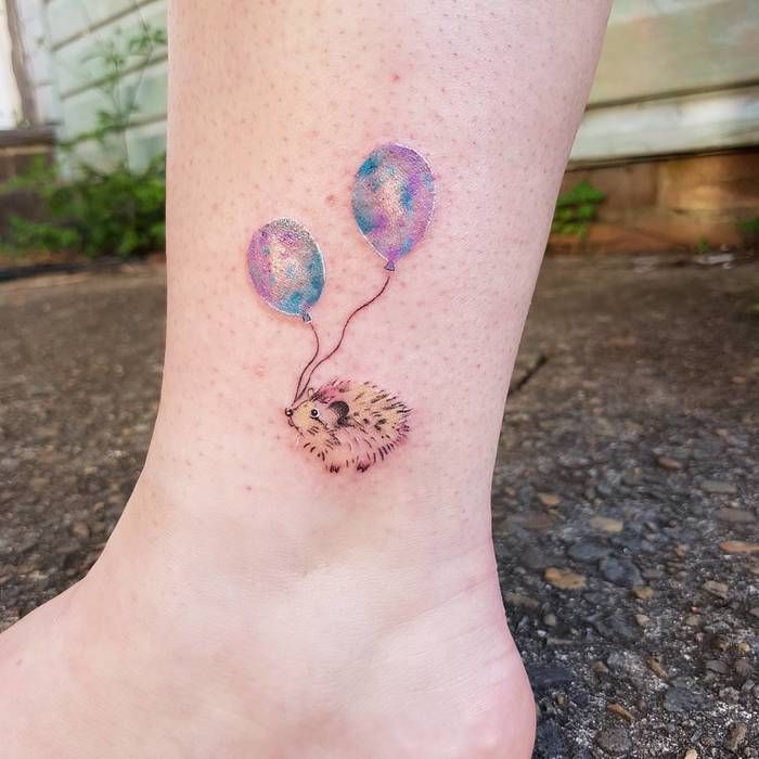 Tattoo of a hedgehog on the ankle for women