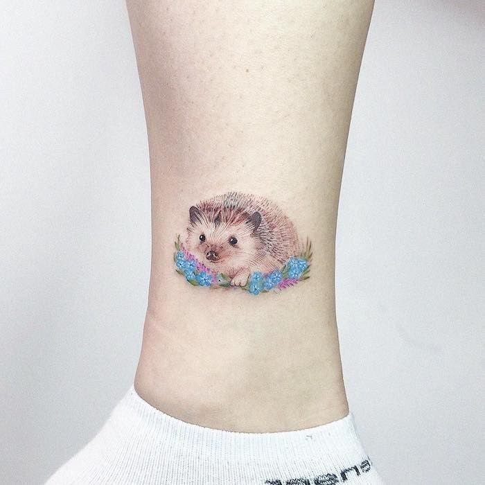 Tattoo of a hedgehog on the lower leg for women