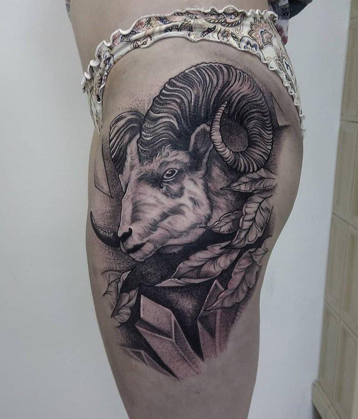 Tattoo of a ram on the hip for women