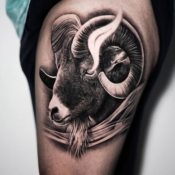 Tattoo of a ram on the thigh