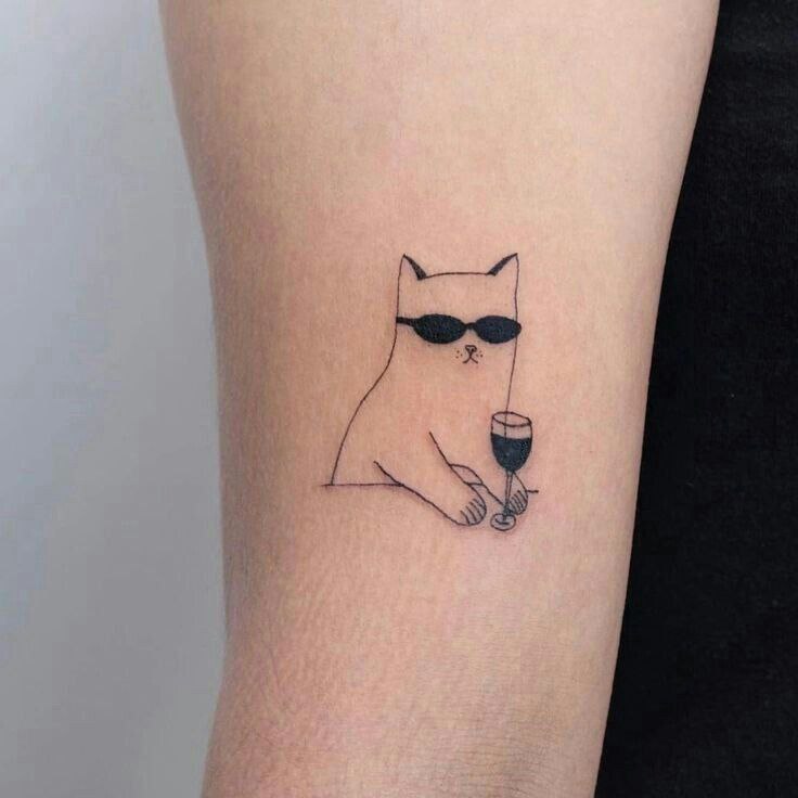 Cat tattoo on the shoulder for women