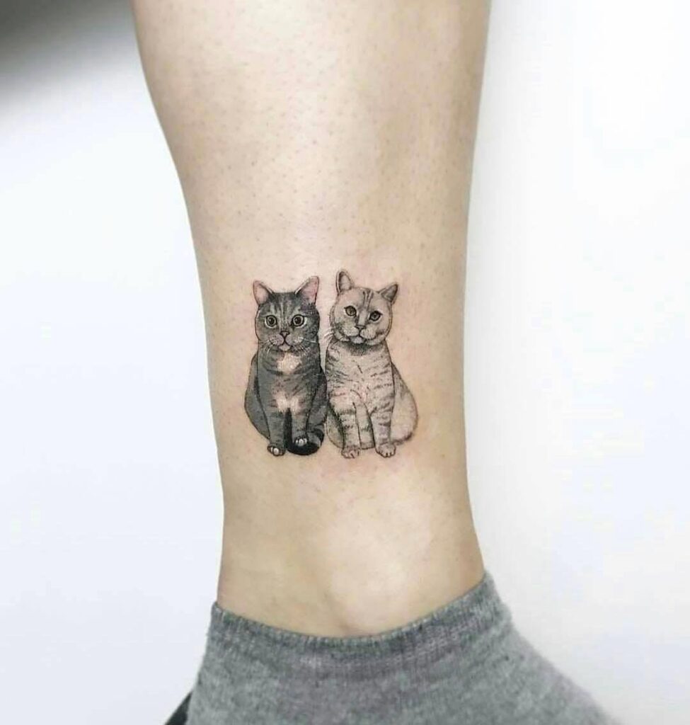 Cat tattoo on the shin for women