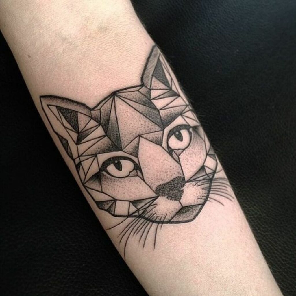 Cat tattoo on the forearm for women