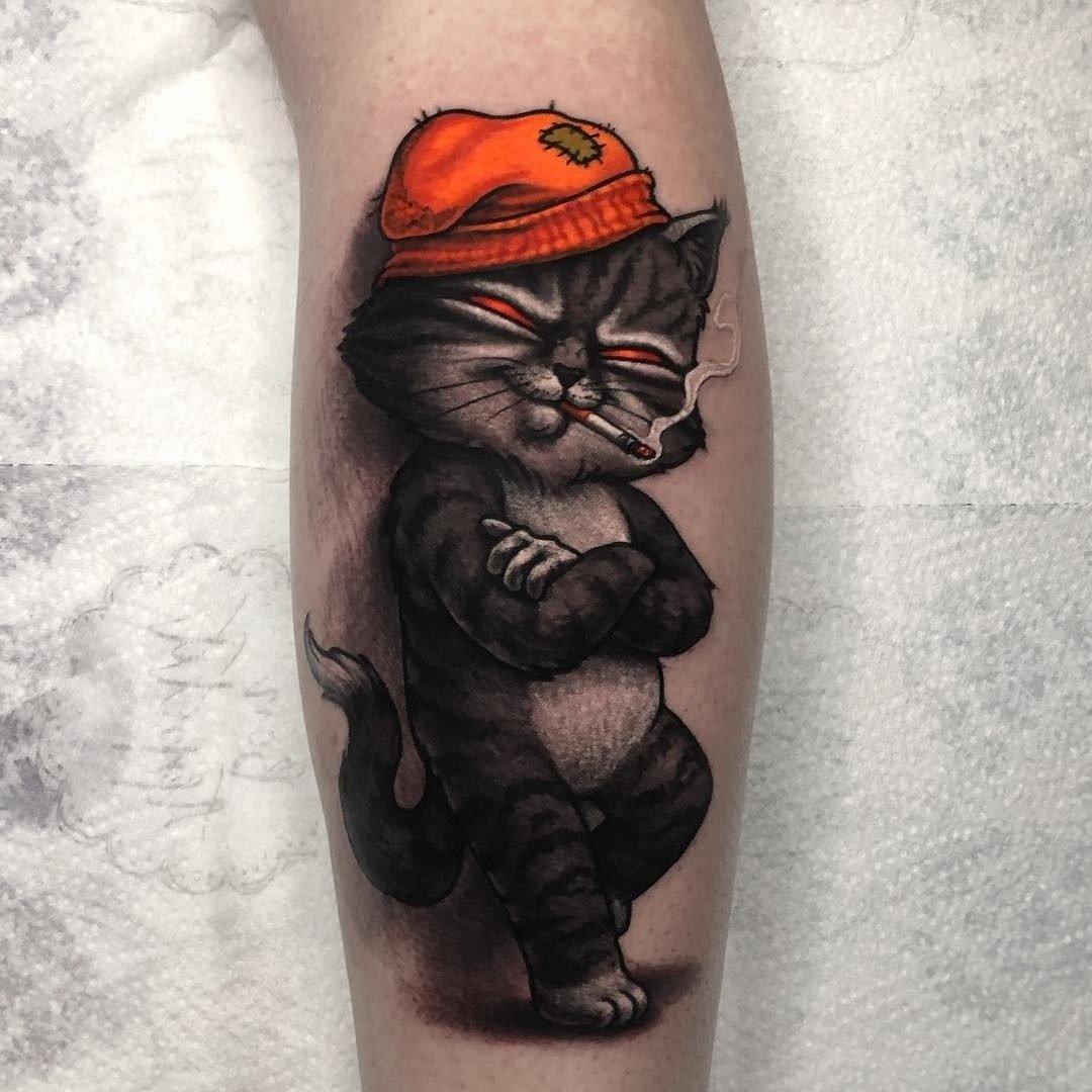 Tattoo of a cat on the leg for men