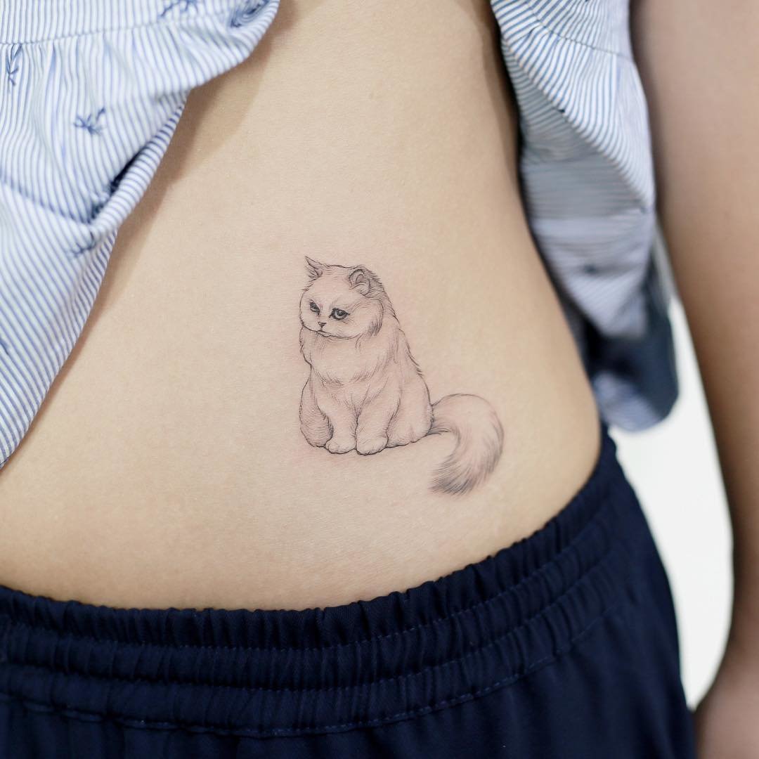 Cat tattoo on the side for women