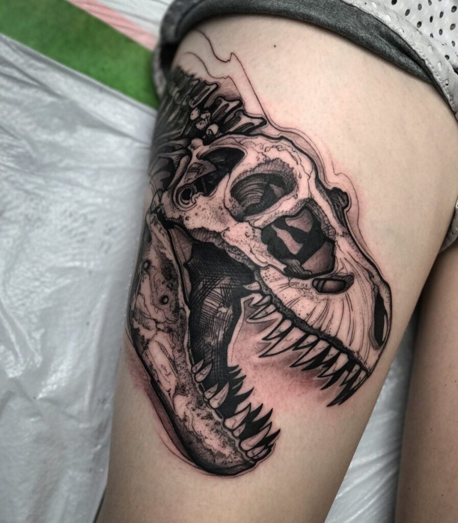 Dinosaur tattoo on the hip for women