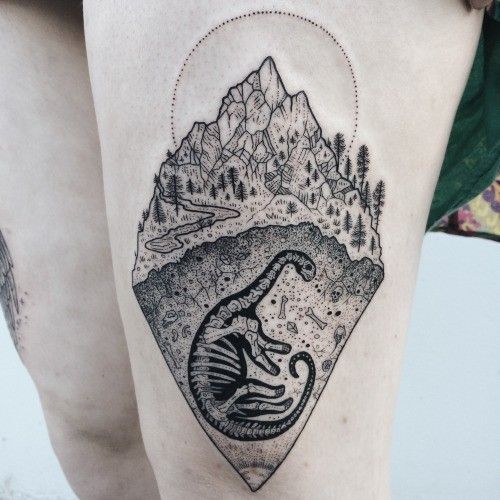 Dinosaur tattoo on the hip for women