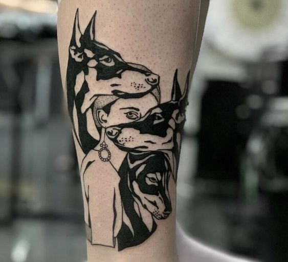 Doberman tattoo on the shin for women