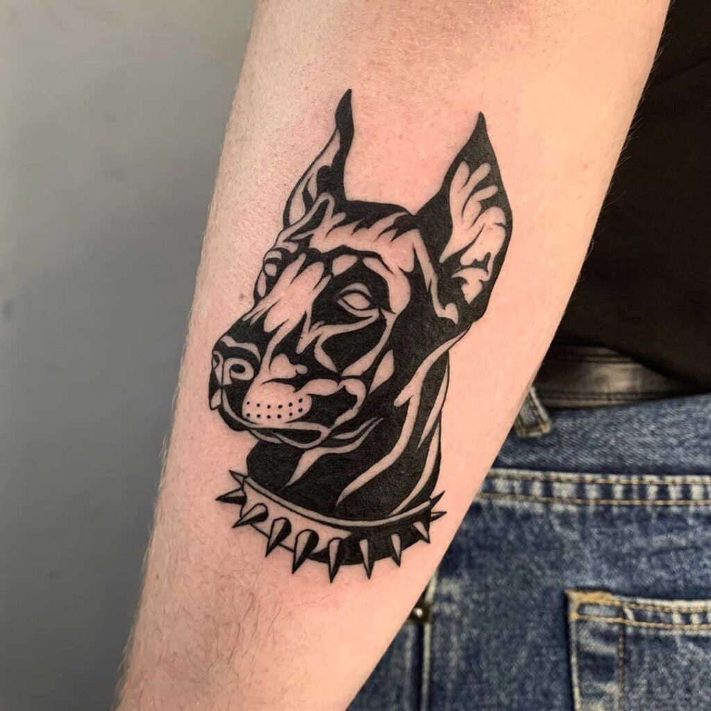 Doberman tattoo on the forearm for women