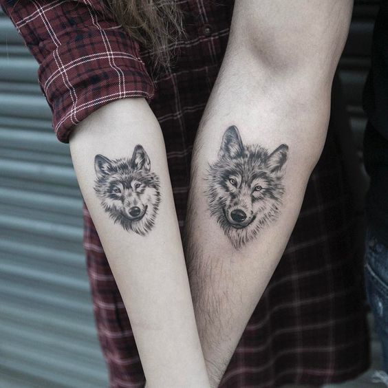 Tattoo of a wolf on the arms