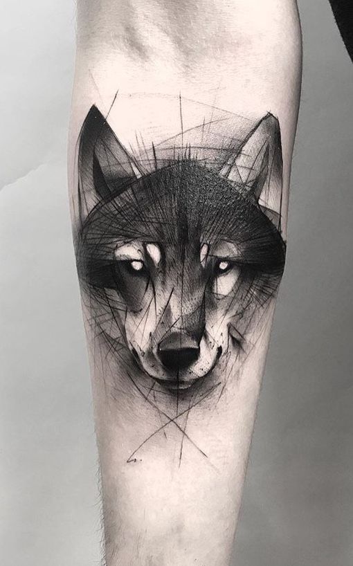 Tattoo of a wolf on the forearm for men