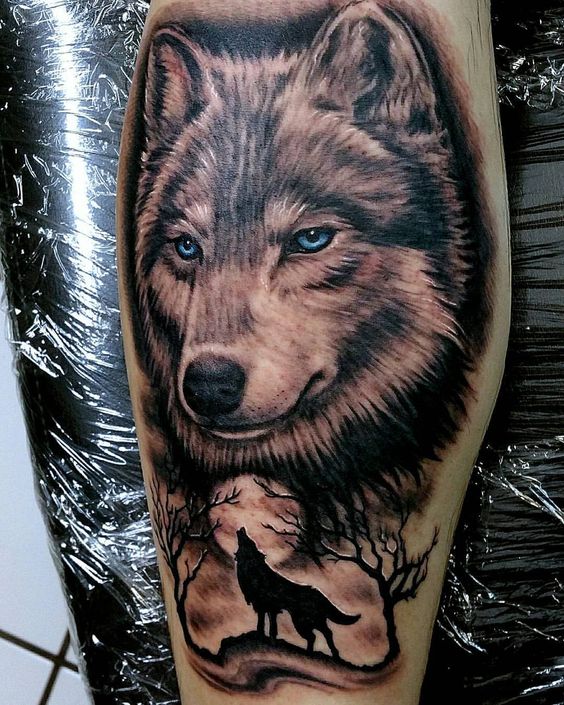 Tattoo of a wolf on the shin for men