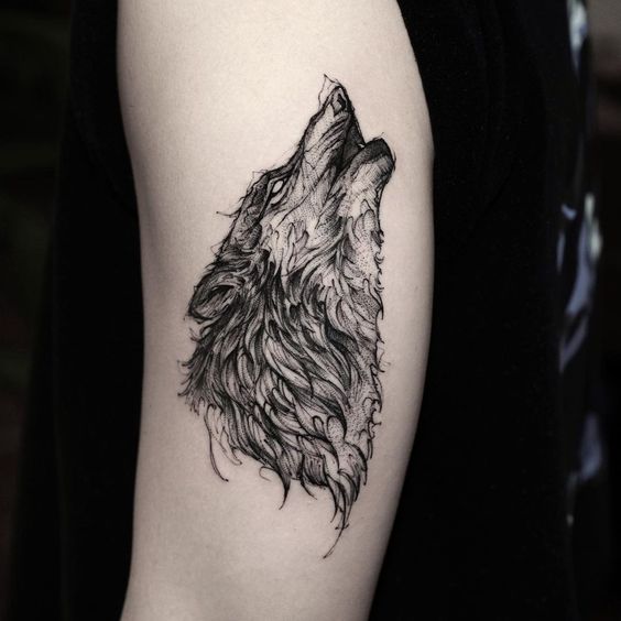 Tattoo of a wolf on the shoulder for men